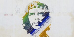 Colorful vintage cars parked by a mural on a Cuban street, showcasing local art and culture.