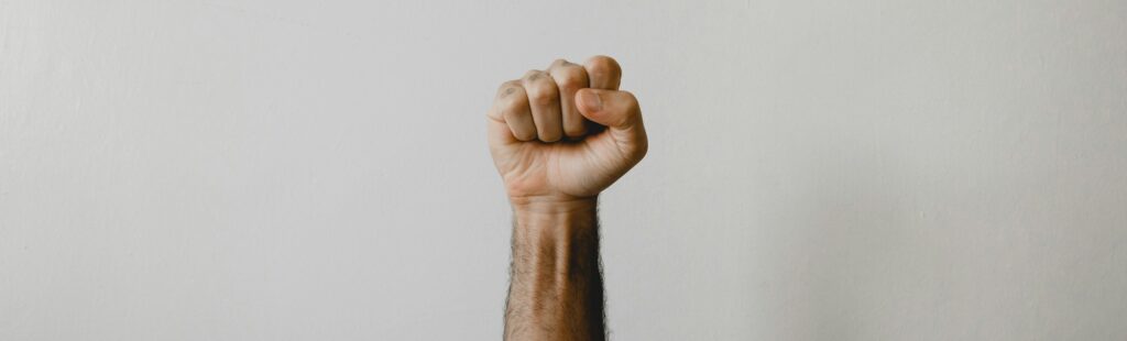 persons right foot on white wall