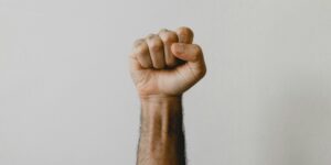 persons right foot on white wall