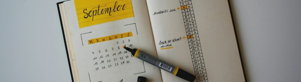 white planner with pen on top